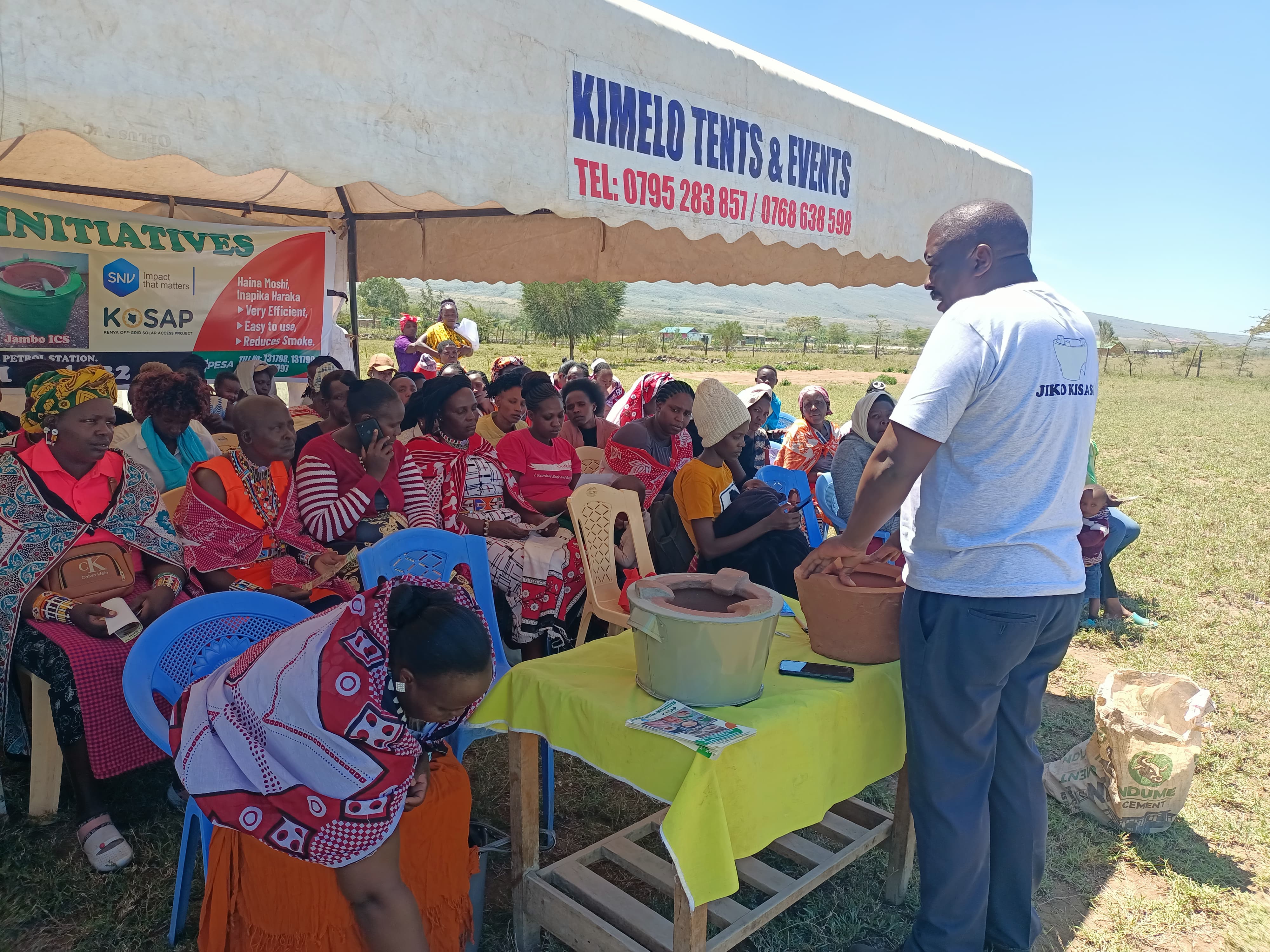 Participants building cookstoves